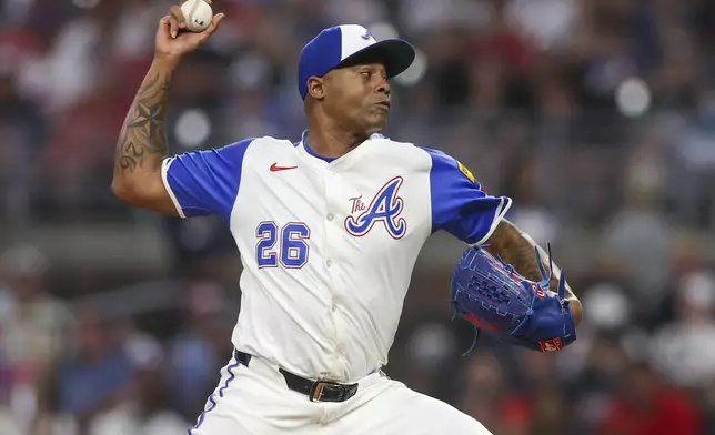 Atlanta Braves relief pitcher Raisel Iglesias delivers in the ninth inning of a baseball game against the Philadelphia Phillies, Saturday, July 6, 2024, in Atlanta. (AP Photo/Brett Davis)