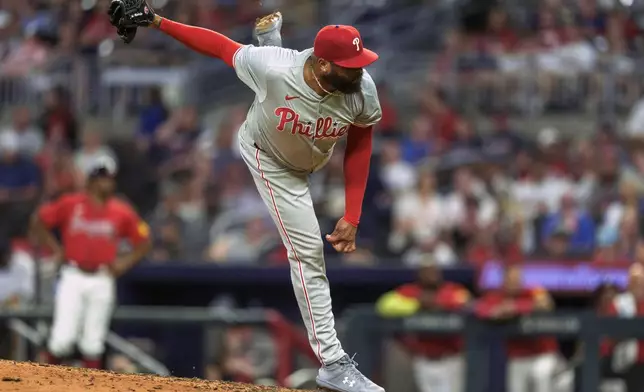 Philadelphia Phillies' pitcher José Alvarado (46) delivers in the eighth inning of a baseball game against the Atlanta Braves, Friday, July 5, 2024, in Atlanta. (AP Photo/Jason Allen)