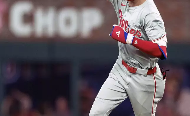 Philadelphia Phillies' Trea Turner rounds second base after hitting his second home run of the night in the sixth inning of a baseball game against the Atlanta Braves, Friday, July 5, 2024, in Atlanta. (AP Photo/Jason Allen)