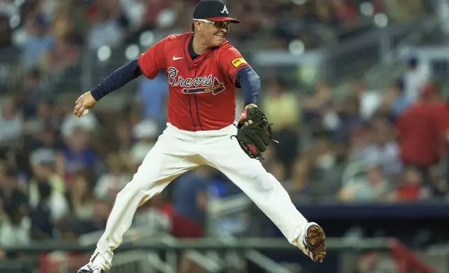 Atlanta Braves' pitcher Jesse Chavez throws in the eighth inning of a baseball game against the Philadelphia Phillies, Friday, July 5, 2024, in Atlanta. (AP Photo/Jason Allen)