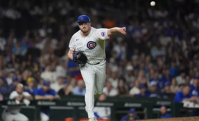 Chicago Cubs' pitcher Luke Little throws to first to force out Philadelphia Phillies' Bryson Stott during the ninth inning of a baseball game Wednesday, July 3, 2024, in Chicago. (AP Photo/Erin Hooley)