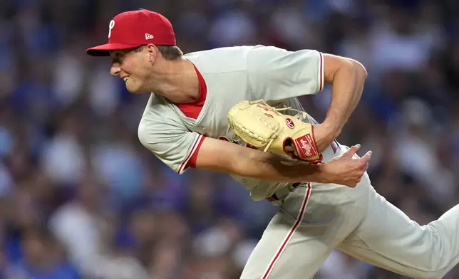 Philadelphia Phillies starting pitcher Michael Mercado follows through during the fourth inning of a baseball game against the Chicago Cubs Tuesday, July 2, 2024, in Chicago. (AP Photo/Charles Rex Arbogast)