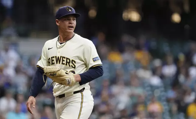 Milwaukee Brewers' Tobias Myers reacts to a defensive play as he walks to the dugout in the fourth inning of a baseball game against the Pittsburgh Pirates, Wednesday, July 10, 2024, in Milwaukee. (AP Photo/Aaron Gash)