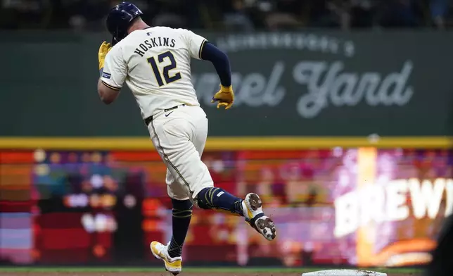 Milwaukee Brewers' Rhys Hoskins rounds the bases after hitting a solo home run during the fifth inning of a baseball game against the Pittsburgh Pirates, Wednesday, July 10, 2024, in Milwaukee. (AP Photo/Aaron Gash)