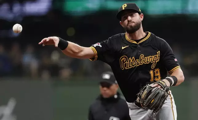 Pittsburgh Pirates' Jared Triolo throws a runner out at first base during the fifth inning of a baseball game against the Milwaukee Brewers Wednesday, July 10, 2024, in Milwaukee. (AP Photo/Aaron Gash)