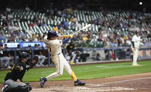 Milwaukee Brewers' Willy Adames hits a three-run home run during the eighth inning of a baseball game against the Pittsburgh Pirates, Wednesday, July 10, 2024, in Milwaukee. (AP Photo/Aaron Gash)