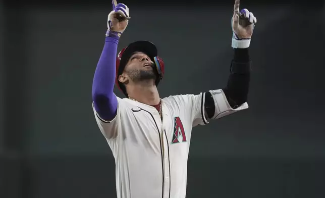 Arizona Diamondbacks' Lourdes Gurriel Jr. reacts after hitting a single against the Pittsburgh Pirates in the sixth inning during a baseball game, Friday, July 26, 2024, in Phoenix. (AP Photo/Rick Scuteri)