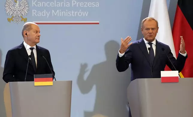 German Chancellor Olaf Scholz, left, and Polish Prime Minister Donald Tusk attend a press conference after German-Polish inter-governmental consultations in front of Prime Minister Chancellery in Warsaw, Poland, Tuesday, July 2, 2024. (AP Photo/Czarek Sokolowski)