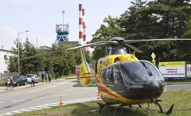 An airborne ambulance near the Rydultowy coal mine near the city of Rybnik, in southern Poland, on Thursday, July 11, 2024. Officials say that two Polish coal miners remain unaccounted for and at least 15 have been injured after a powerful tremor shook the Rydultowy coal mine. Rescuers are struggling to reach dozens of others. (AP Photo/Katarzyna Zaremba-Majcher)