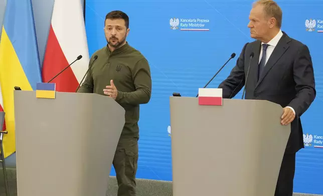 Poland's Prime Minister Donald Tusk, right, and Ukrainian President Volodymyr Zelenskyy attend a news conference during their meeting in Warsaw, Poland, Monday, July 8 , 2024. (AP Photo/Czarek Sokolowski)