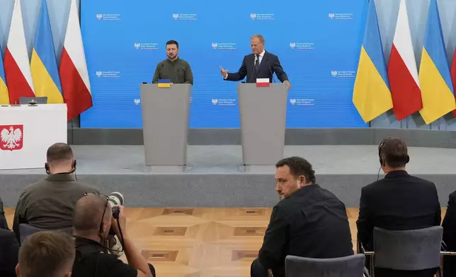 Poland's Prime Minister Donald Tusk, right, and Ukrainian President Volodymyr Zelenskyy attend a news conference during their meeting in Warsaw, Poland, Monday, July 8 , 2024. (AP Photo/Czarek Sokolowski)