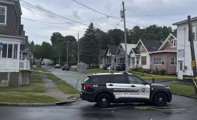 Police investigate the scene of Friday nights shooting in Utica, N.Y., early Saturday, June 29, 2024. An officer shot and killed a teen fleeing while pointing a replica gun, police said Saturday. (Kenny Lacy Jr./Syracuse.com via AP)