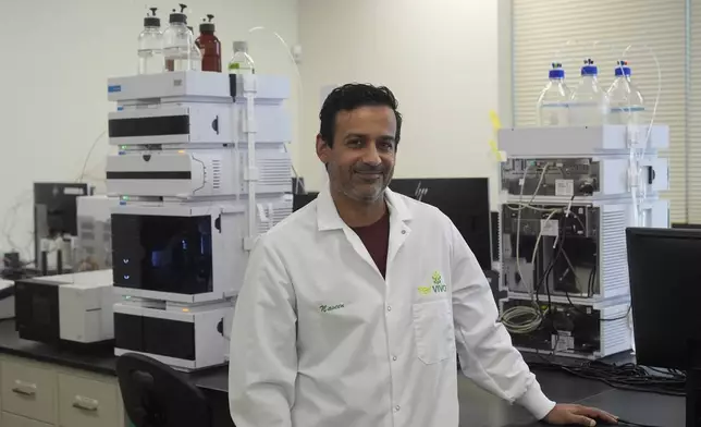 Naveen Sikka, founder and CEO of Terviva, stands in the lab at the company's headquarters in Alameda, Calif., Thursday, May 9, 2024. The company patented a process to remove the bitter taste of the pongamia tree legume. The small, brown legume is now being used to produce several products, including Panova table oil, Kona protein bars and protein flour. The legume also produces an oil that can be used as a biofuel, largely for aviation. (AP Photo/Jeff Chiu)