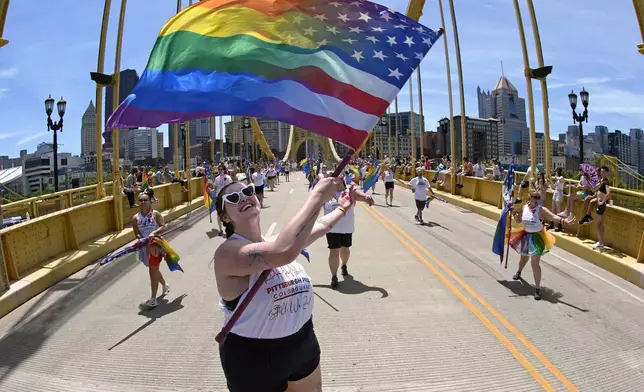 The Pittsburgh Pride Parade 2024 makes its way across the Andy Warhol Bridge in downtown Pittsburgh, Saturday, June 1, 2024. (AP Photo/Gene J. Puskar)
