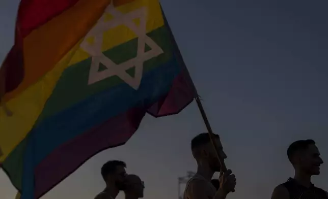 People attend a "Pride and Hope Rally" LGBTQ+ Pride event in Tel Aviv, Israel, Thursday, June 6, 2024. (AP Photo/Ariel Schalit)