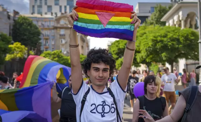 People take part in the Pride parade in Bucharest, Romania, Saturday, June 29, 2024. (AP Photo/Vadim Ghirda)