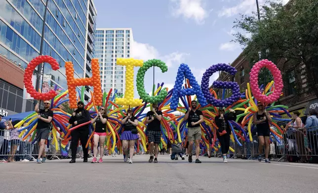 Parade members perform during the 53rd annual Chicago Pride Parade in Chicago, Sunday, June 30, 2024. (Anthony Vazquez/Chicago Sun-Times via AP)