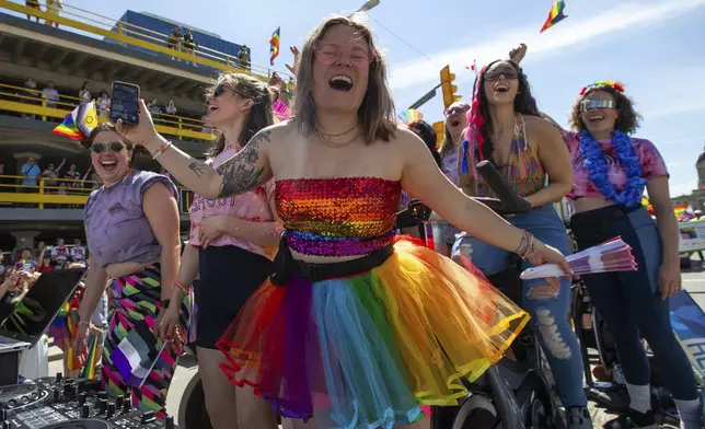 People take part in the Winnipeg Pride Parade, Sunday, June 2, 2024, in Winnipeg, Manitoba. (Daniel Crump/The Canadian Press via AP)