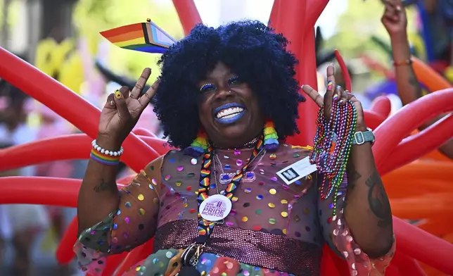 A parade participant gestures during the San Francisco Pride Parade in San Francisco, Sunday, June 30, 2024. (Jose Carlos Fajardo/Bay Area News Group via AP)