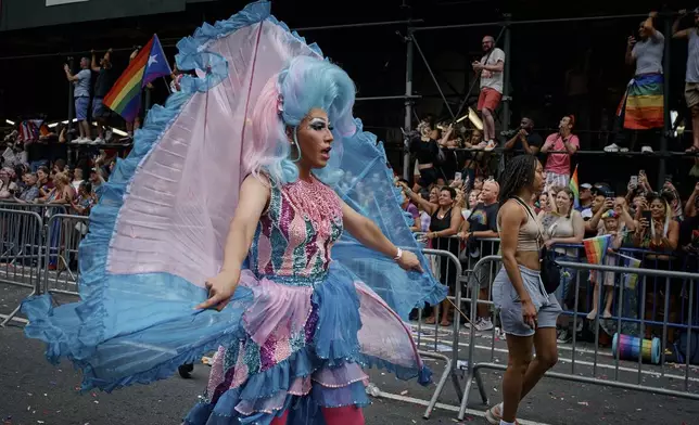 A reveler marches during the NYC Pride March, Sunday, June 30, 2024, in New York. (AP Photo/Andres Kudacki)