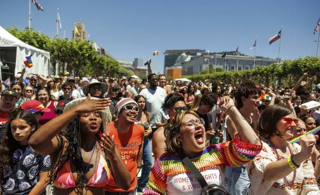 Revelers cheers during a Pride Parade, Sunday, June 30, 2024, in San Francisco. (AP Photo/Ethan Swope)