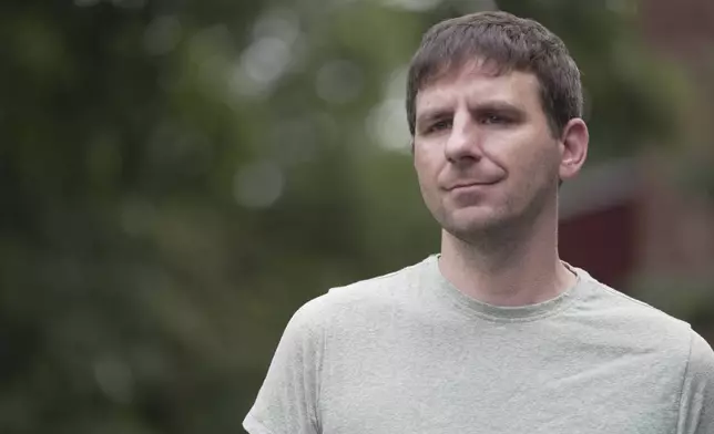 Casey Tylek, a U.S. Army veteran, stands for a portrait at his home in Leominster, Mass., on July 13, 2024. Tylek credits MDMA-assisted therapy with resolving anger, anxiety and trauma stemming from a rocket attack in in Iraq. (AP Photo/Shelby Lum)