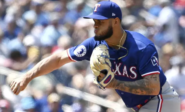 Texas Rangers relief pitcher Jonathan Hernandez throws to a Toronto Blue Jays batter in first-inning baseball game action in Toronto, Sunday, July 28, 2024. (Jon Blacker/The Canadian Press via AP)