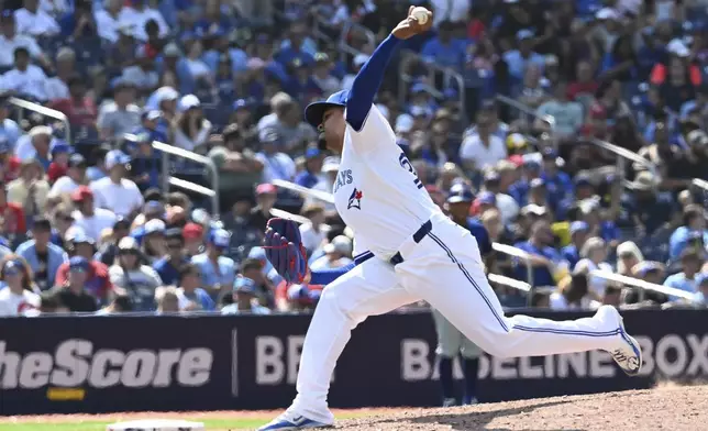 Toronto Blue Jays relief pitcher Genesis Cabrera throws to a Texas Rangers batter in eighth-inning baseball game action in Toronto, Sunday, July 28, 2024. (Jon Blacker/The Canadian Press via AP)