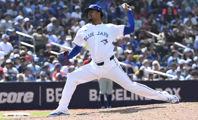 Toronto Blue Jays relief pitcher Genesis Cabrera throws to a Texas Rangers batter in eighth-inning baseball game action in Toronto, Sunday, July 28, 2024. (Jon Blacker/The Canadian Press via AP)