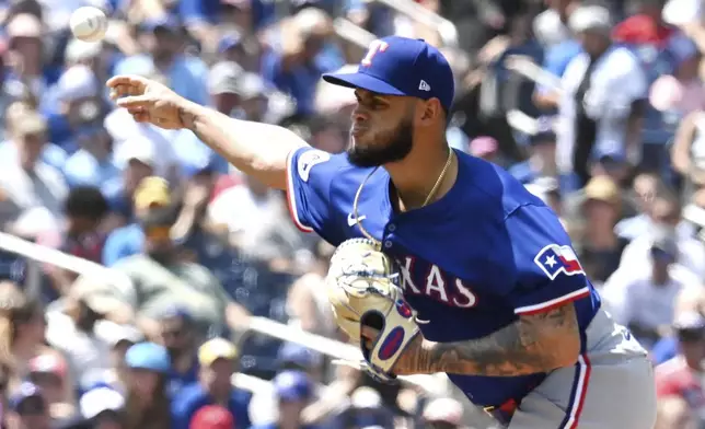 Texas Rangers relief pitcher Jonathan Hernandez throws to a Toronto Blue Jays batter in first-inning baseball game action in Toronto, Sunday, July 28, 2024. (Jon Blacker/The Canadian Press via AP)