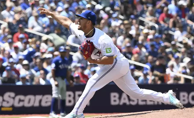 Toronto Blue Jays starting pitcher Jose Barrios throws to a Texas Rangers batter in first-inning baseball game action in Toronto, Sunday, July 28, 2024. (Jon Blacker/The Canadian Press via AP)