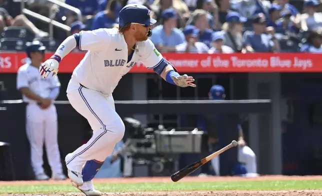 Toronto Blue Jays designated hitter Justin Turner runs out a single against the Texas Rangers in seventh-inning baseball game action in Toronto, Sunday, July 28, 2024. (Jon Blacker/The Canadian Press via AP)