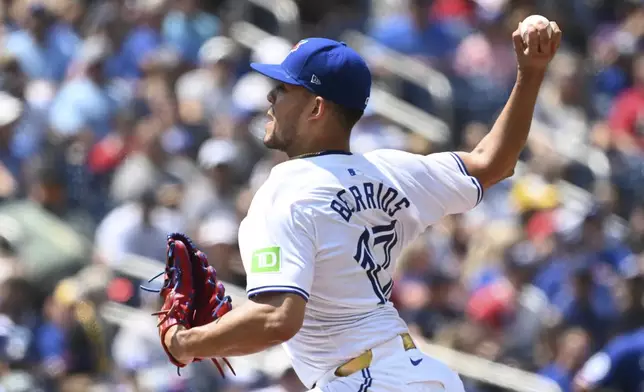 Toronto Blue Jays starting pitcher Jose Barrios throws to a Texas Rangers batter in first-inning baseball game action in Toronto, Sunday, July 28, 2024. (Jon Blacker/The Canadian Press via AP)