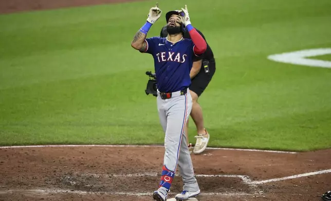 Texas Rangers' Derek Hill celebrates after his home run during the fifth inning of a baseball game against the Baltimore Orioles, Sunday, June 30, 2024, in Baltimore. (AP Photo/Nick Wass)