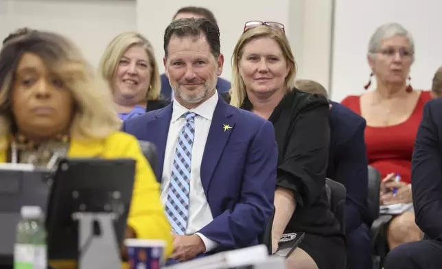 Brian Auld, co-president of the Tampa Bay Rays, smiles moments after the Pinellas County commissioners voted to fund the a new Tampa Bay Rays ballpark during a meeting Tuesday, July 30, 2024, in Clearwater, Fla. (Douglas R. Clifford/Tampa Bay Times via AP)