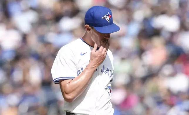 Toronto Blue Jays pitcher Chris Bassitt walks back to the dugout after giving up two runs to the Tampa Bay Rays during third-inning baseball game action in Toronto, Thursday, July 25, 2024. (Chris Young/The Canadian Press via AP)