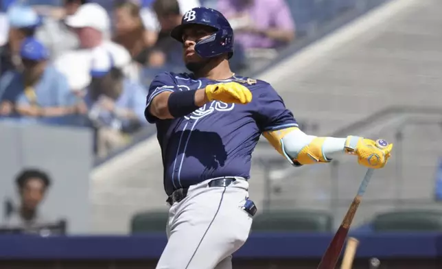 Tampa Bay Rays' Isaac Paredes watches his RBI double off Toronto Blue Jays pitcher Chris Bassitt during third-inning baseball game action in Toronto, Thursday, July 25, 2024. (Chris Young/The Canadian Press via AP)