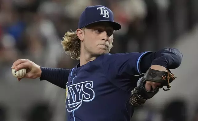 Tampa Bay Rays starting pitcher Shane Baz throws during the first inning of a baseball game against the Texas Rangers in Arlington, Texas, Friday, July 5, 2024. (AP Photo/LM Otero)