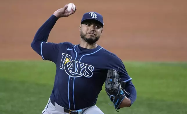 Tampa Bay Rays starting pitcher Taj Bradley throws to the Texas Rangers in the fourth inning of a baseball game in Arlington, Texas, Saturday, July 6, 2024. (AP Photo/Tony Gutierrez)