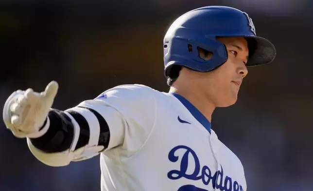 Los Angeles Dodgers designated hitter Shohei Ohtani runs the bases after hitting a solo home run during the fifth inning of a baseball game against the Boston Red Sox, Sunday, July 21, 2024, in Los Angeles. (AP Photo/Ryan Sun)