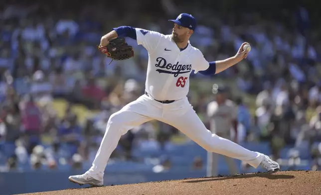 Los Angeles Dodgers starting pitcher James Paxton throws during the first inning of a baseball game against the Boston Red Sox, Sunday, July 21, 2024, in Los Angeles. (AP Photo/Ryan Sun)