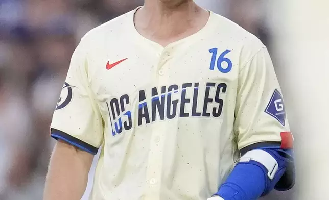 Los Angeles Dodgers' Will Smith celebrates after driving in the winning run with a single during the 11th inning of a baseball game against the Boston Red Sox, Saturday, July 20, 2024, in Los Angeles. (AP Photo/Marcio Jose Sanchez)