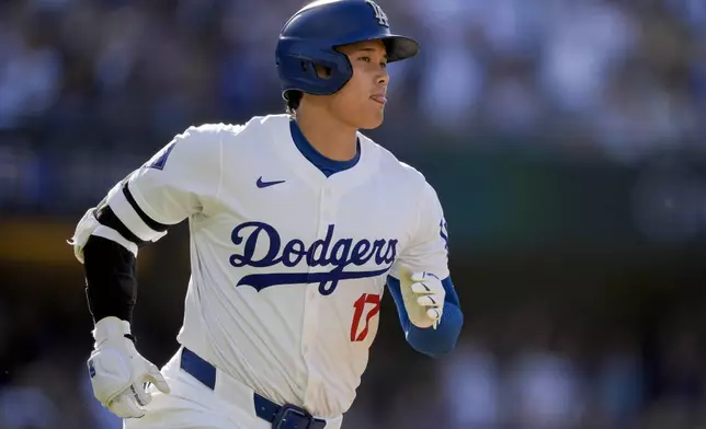 Los Angeles Dodgers designated hitter Shohei Ohtani runs the bases after hitting a solo home run during the fifth inning of a baseball game against the Boston Red Sox, Sunday, July 21, 2024, in Los Angeles. (AP Photo/Ryan Sun)