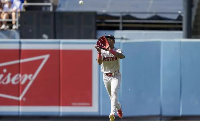 Boston Red Sox center fielder Ceddanne Rafaela catches out a fly ball hit by Los Angeles Dodgers' Miguel Rojas during the first inning of a baseball game, Sunday, July 21, 2024, in Los Angeles. (AP Photo/Ryan Sun)