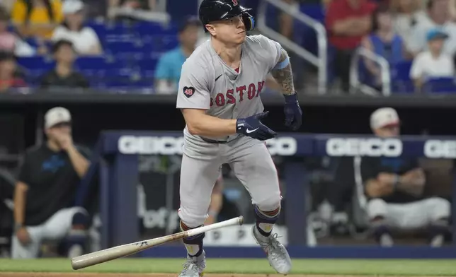 Boston Red Sox's Tyler O'Neill hits a single during the first inning of a baseball game against the Miami Marlins, Thursday, July 4, 2024, in Miami. (AP Photo/Marta Lavandier)