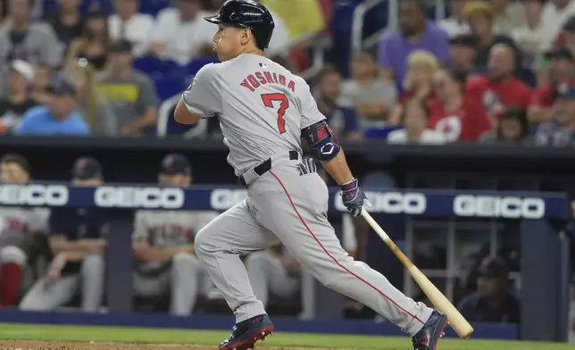 Boston Red Sox's Masataka Yoshida (7) hits a single during the second inning of a baseball game against the Miami Marlins, Wednesday, July 3, 2024, in Miami. (AP Photo/Marta Lavandier)