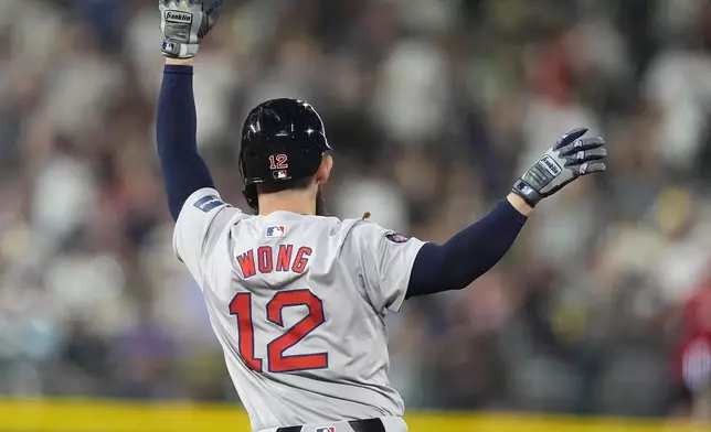 Boston Red Sox's Connor Wong celebrates as he circles the bases after hitting a solo home run off Colorado Rockies relief pitcher Jalen Beeks in the eighth inning of a baseball game Monday, July 22, 2024, in Denver. (AP Photo/David Zalubowski)