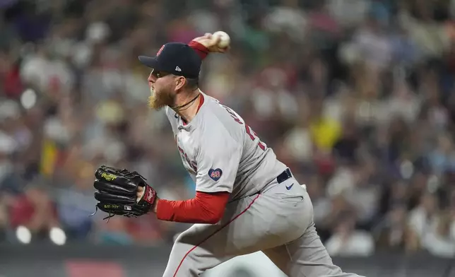 Boston Red Sox relief pitcher Zack Kelly works against the Colorado Rockies in the ninth inning of a baseball game Monday, July 22, 2024, in Denver. (AP Photo/David Zalubowski)