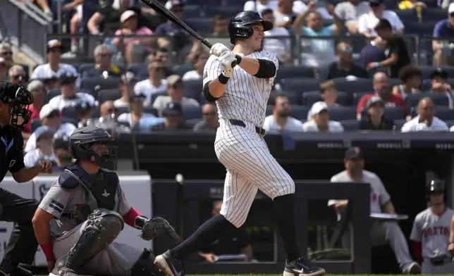 New York Yankees' Ben Rice hits a home run in the seventh inning of a baseball game against the Boston Red Sox, Saturday, July 6, 2024, in New York. (AP Photo/Pamela Smith)