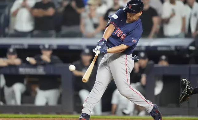 Boston Red Sox's Masataka Yoshida, of Japan, hits a two-run home run during the ninth inning of a baseball game against the New York Yankees, Friday, July 5, 2024, in New York. (AP Photo/Frank Franklin II)